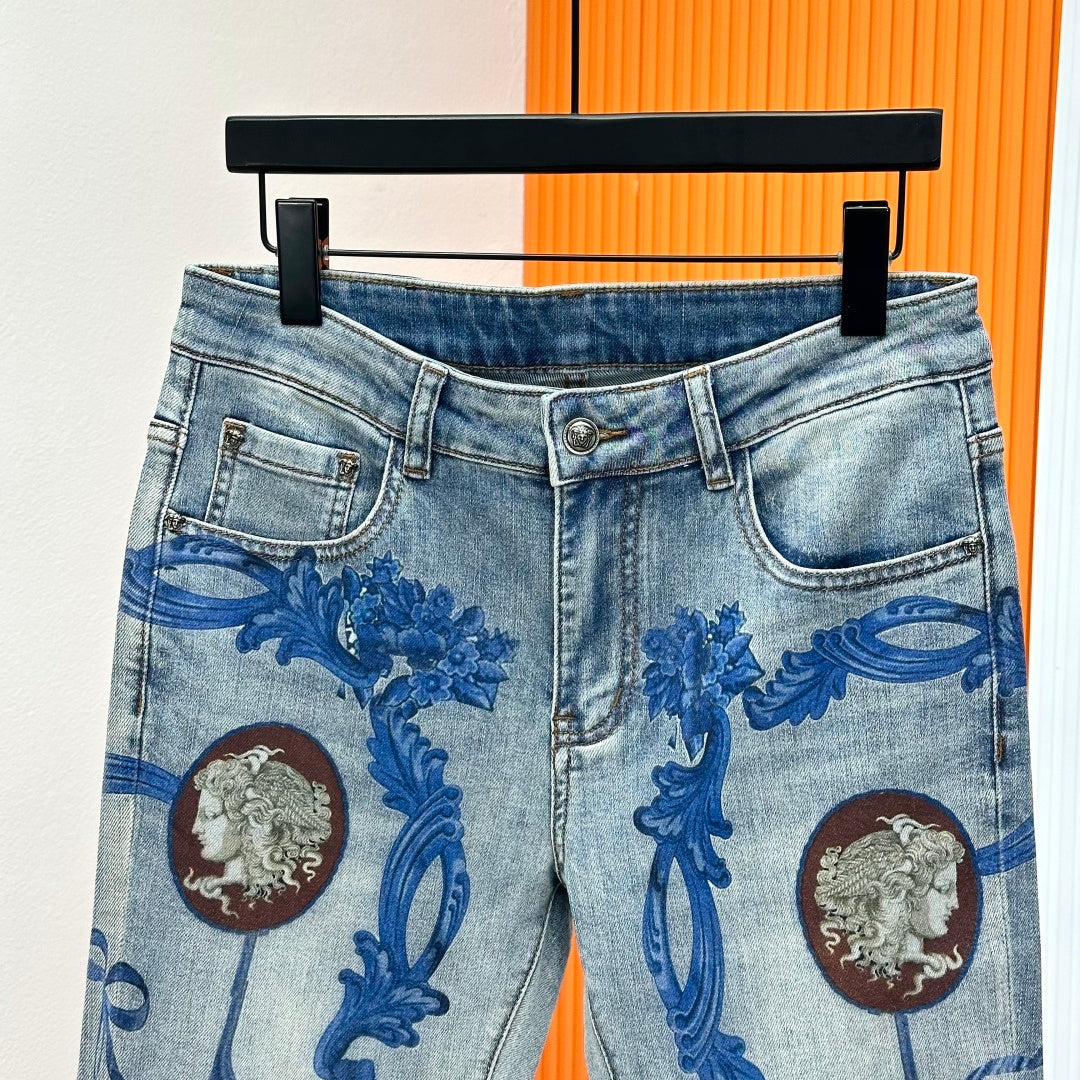 Versace light-wash denim jeans with button fly and blue baroque print