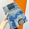 Versace light-wash denim jeans with blue baroque print and medallion motif