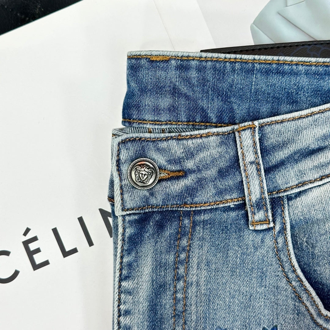 Versace denim jeans with logo patch at waistband and button closure