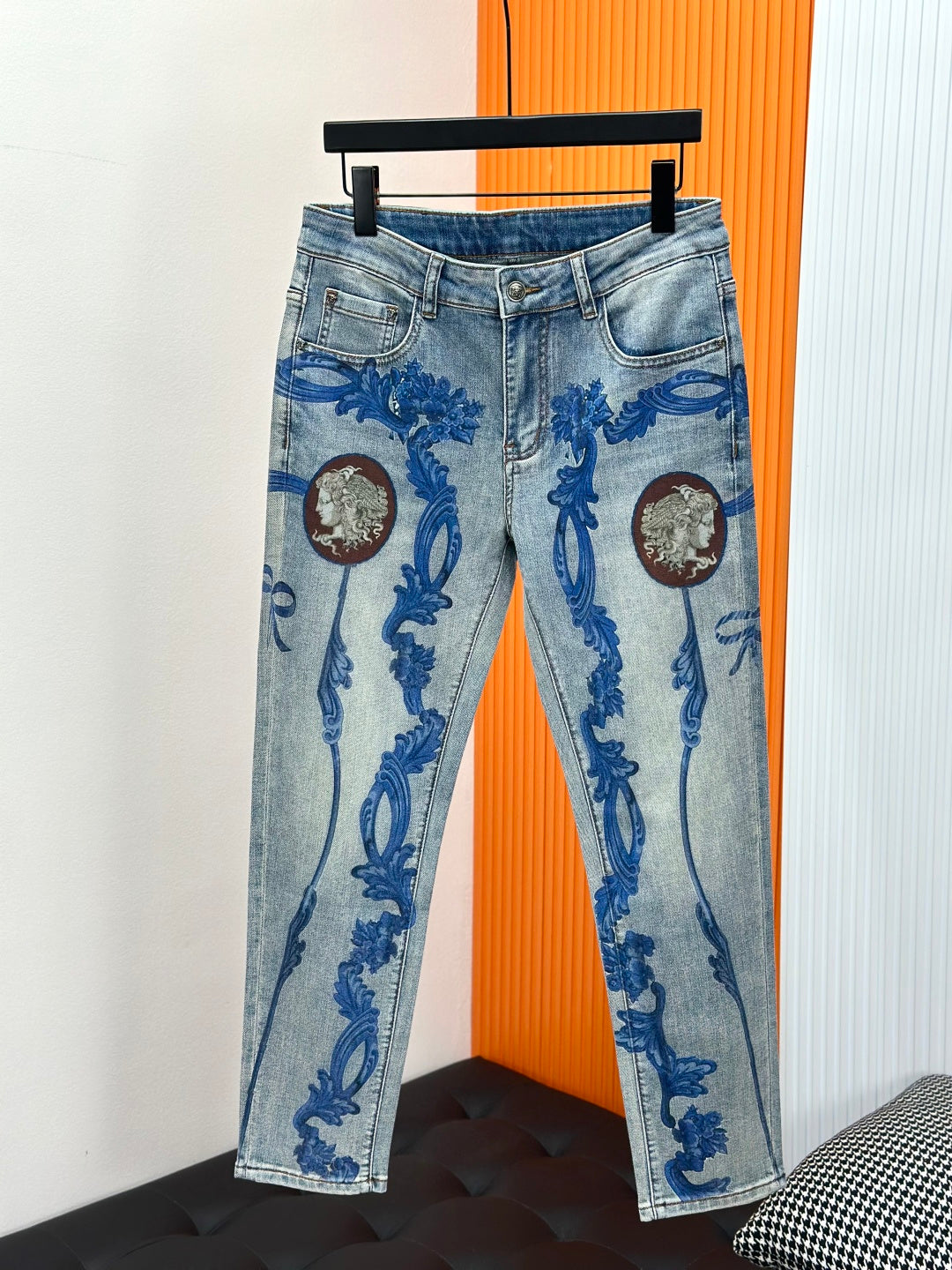 Versace light-wash denim jeans with blue baroque motif and round medallion prints