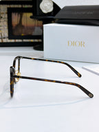 Tortoiseshell full-rim eyeglasses side profile with metal hinge details