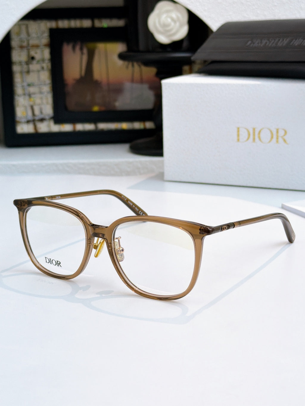 Gold-toned full-rim eyeglasses with Dior logo and clear lenses