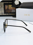 Black full-rim eyeglasses with metal hinges and curved temple, Dior logo