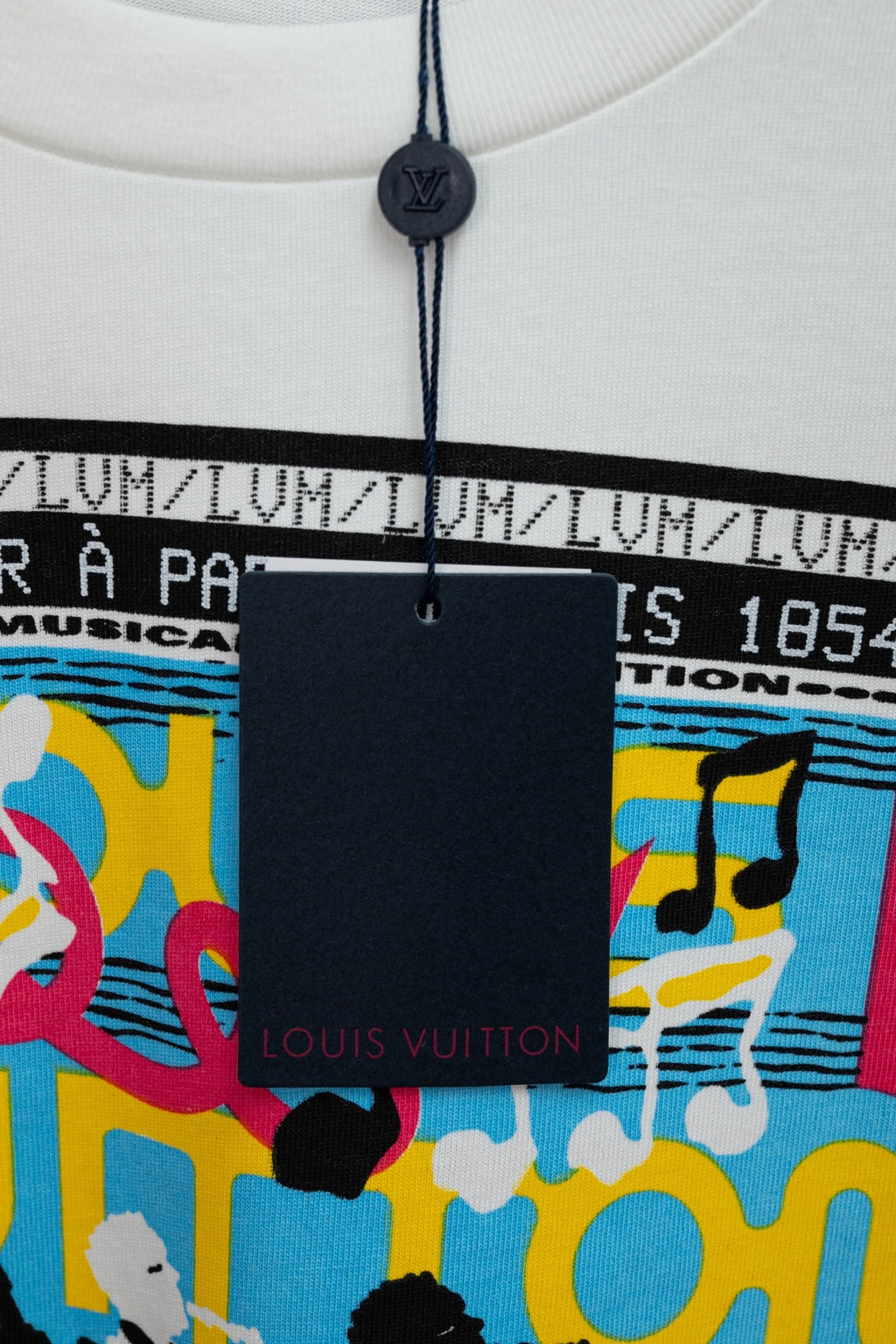 White Louis Vuitton T-shirt with black hanger tag near crew neck