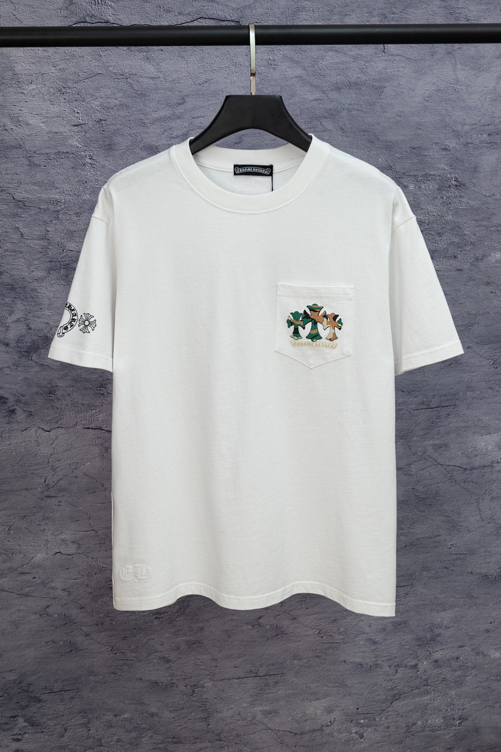 White short-sleeve T-shirt with small chest graphic and logo on left sleeve