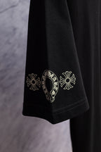 Black T-shirt sleeve with white floral graphic print