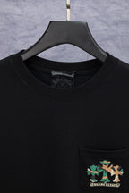 Black crewneck T-shirt with front pocket and chest logo patch