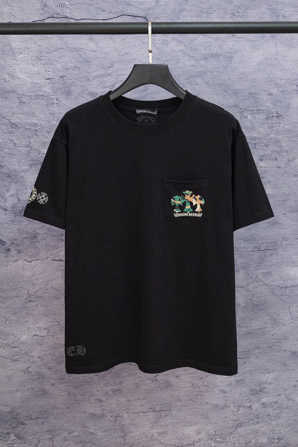 Black short-sleeve T-shirt with small chest logo patch