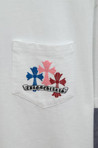 White T-shirt chest pocket with colorful floral emblem and logo text