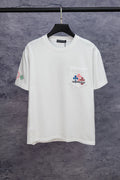 White short-sleeve T-shirt with small left-chest graphic patch