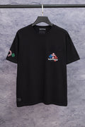 Black short-sleeve T-shirt with chest logo patch and colorful sleeve graphic