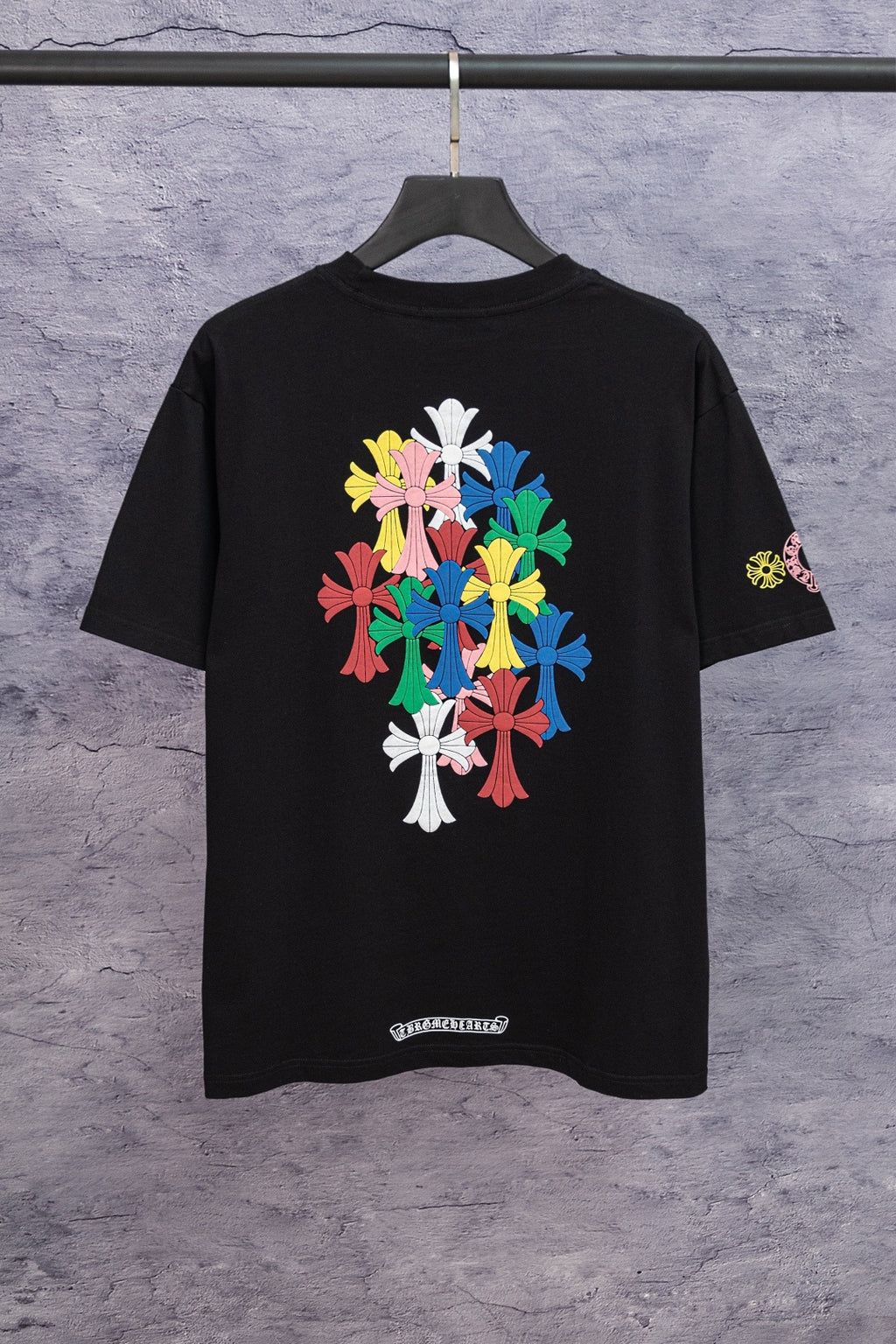 Black short-sleeve T-shirt with large back floral cross graphic and sleeve logo