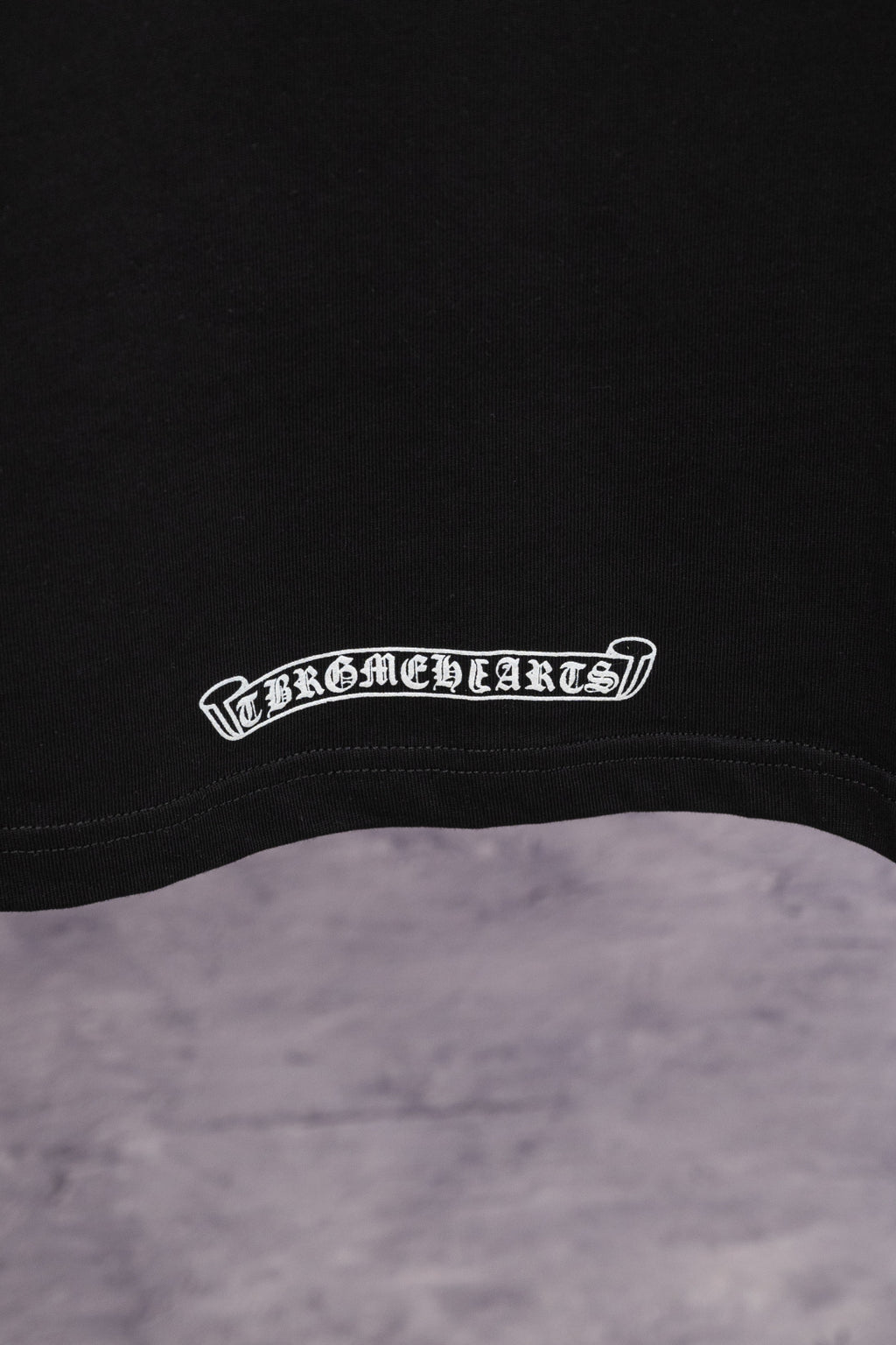 Black T-shirt with white arched hem logo print