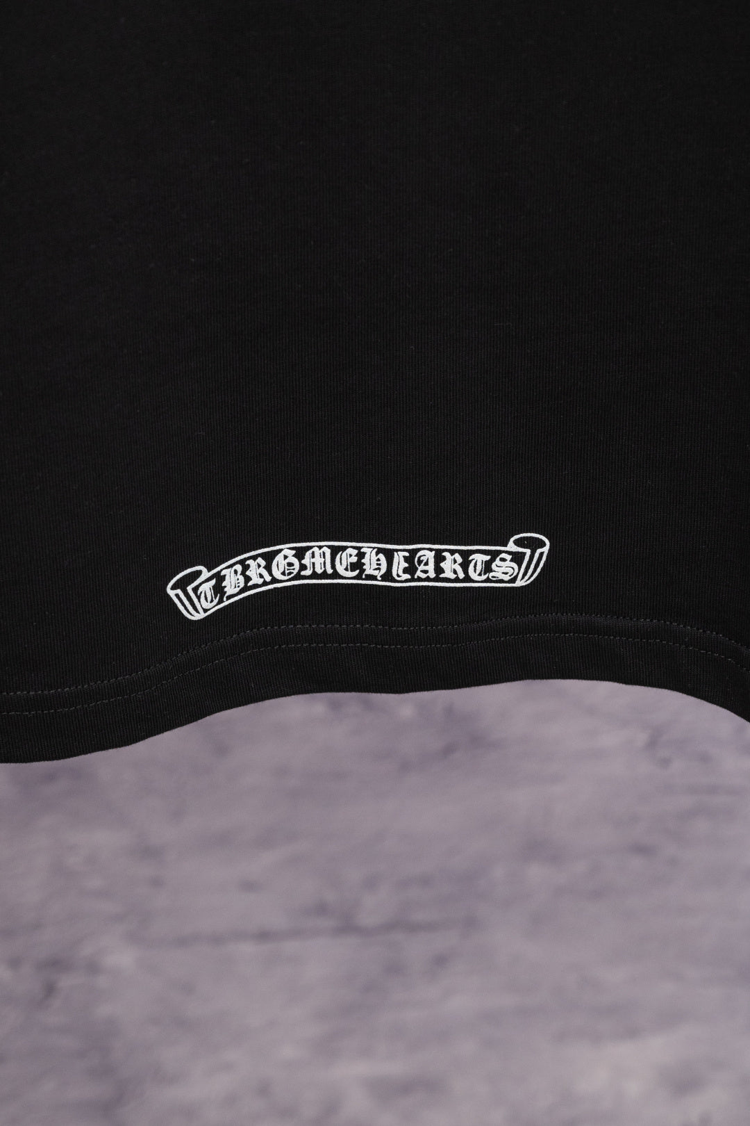 Black T-shirt with white arched hem logo print