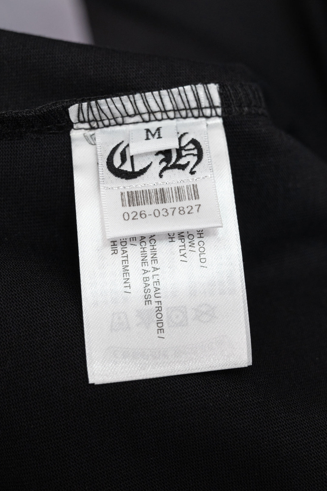 Black T-shirt size label tag marked M