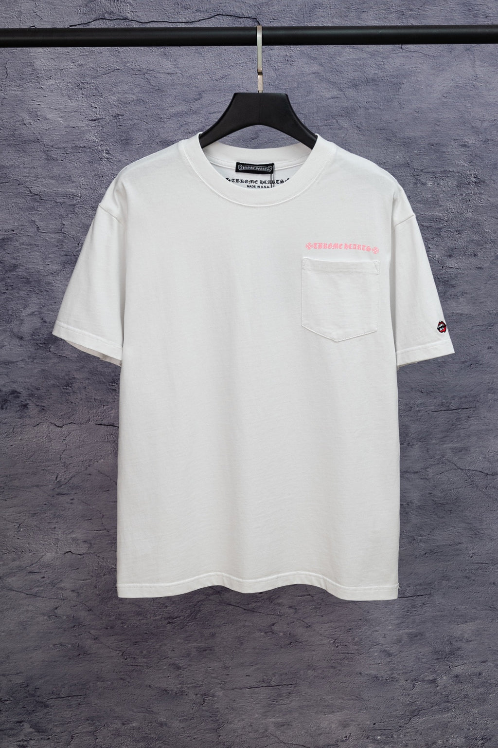 White short-sleeve T-shirt with small chest logo and crew neckline