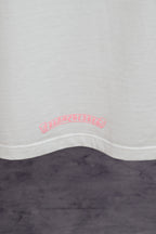 White T-shirt hem with small pink back graphic print