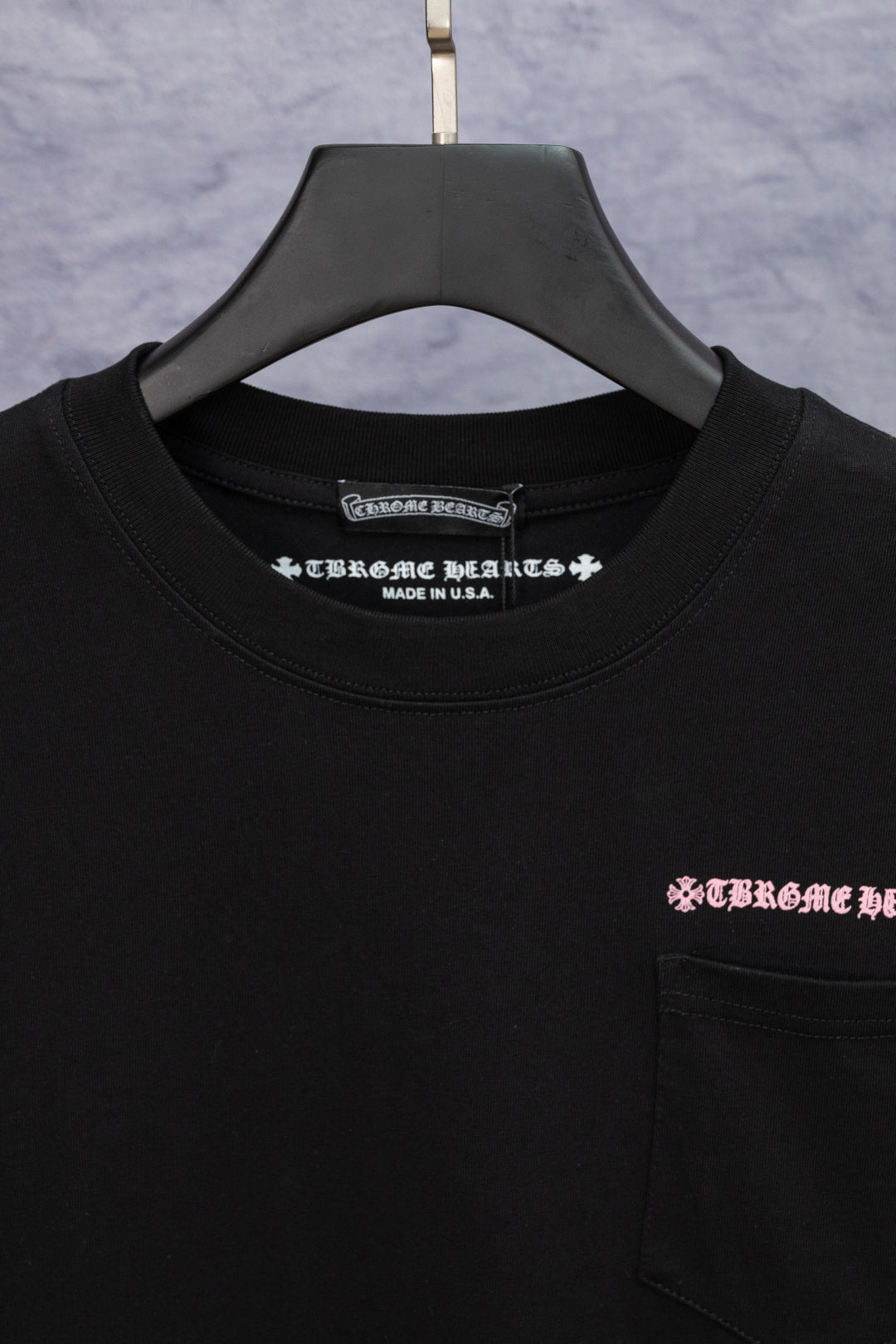 Black short-sleeve T-shirt neckline with small Chrome Hearts logo and Made in U.S.A.