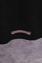 Black short-sleeve T-shirt with small Chrome Hearts oval logo at hem