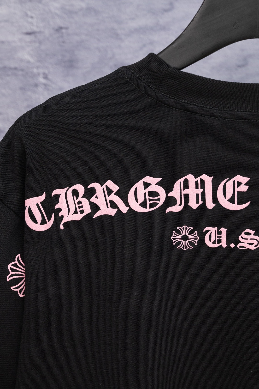 Black short-sleeve T-shirt with large pink Chrome Hearts back graphic