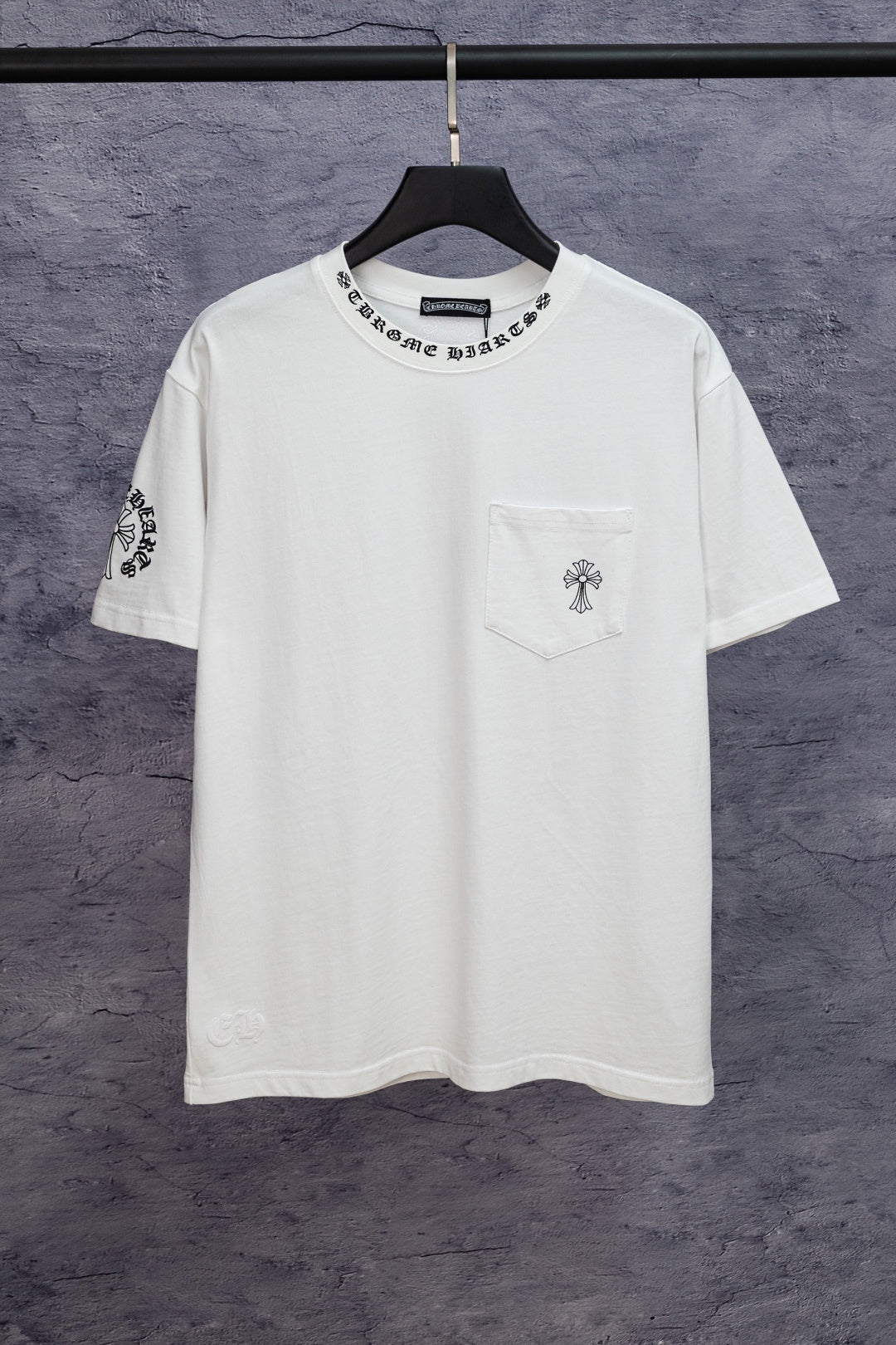 White short-sleeve T-shirt with small chest graphic and chest pocket detail