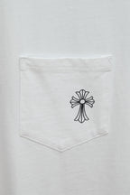 White T-shirt chest pocket with small black cross graphic