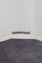 White T-shirt hem with small black logo badge