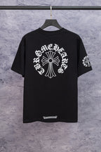 Black short-sleeve graphic T-shirt with large cross-like emblem print on back