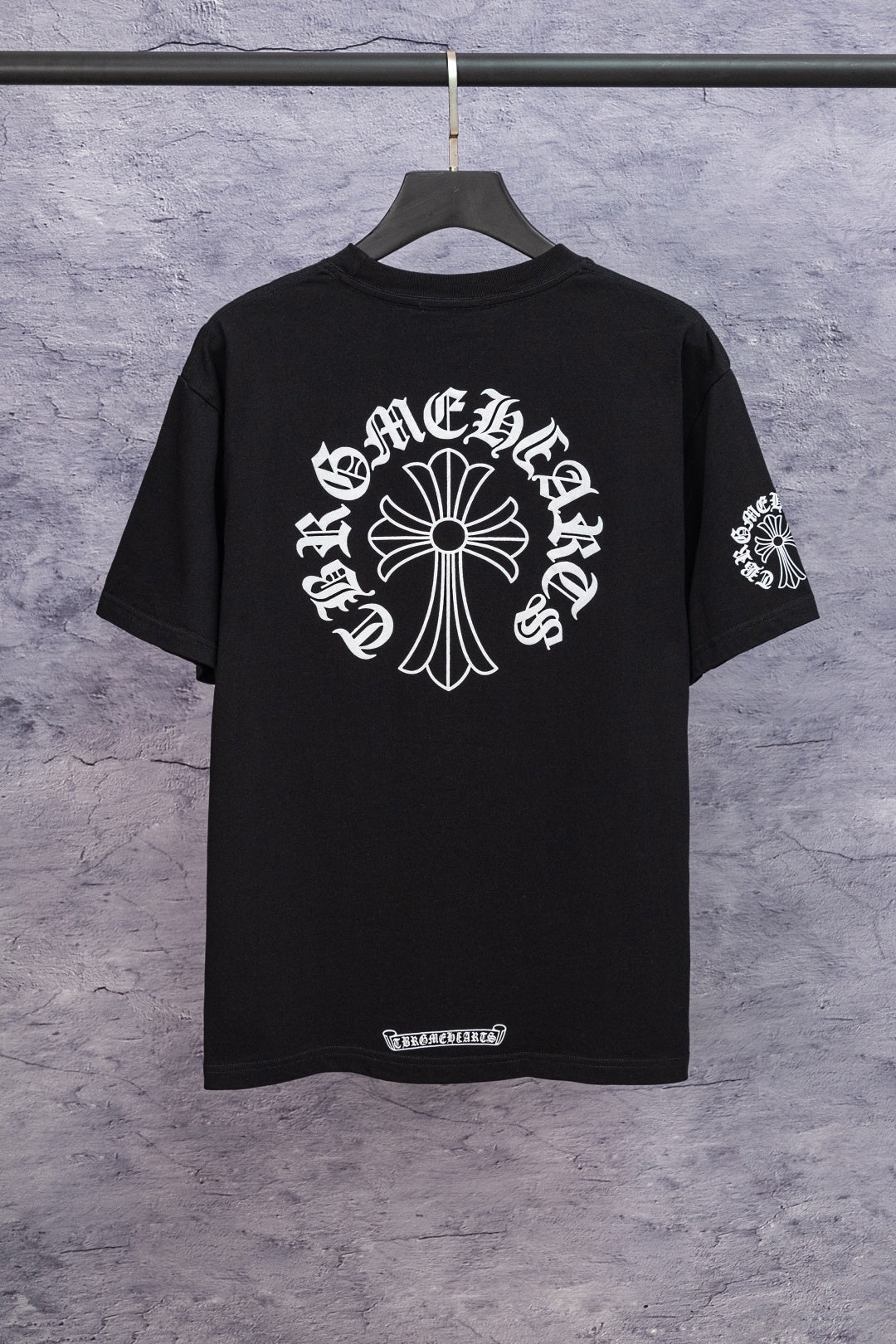 Black short-sleeve T-shirt with large back cross-style graphic and sleeve print