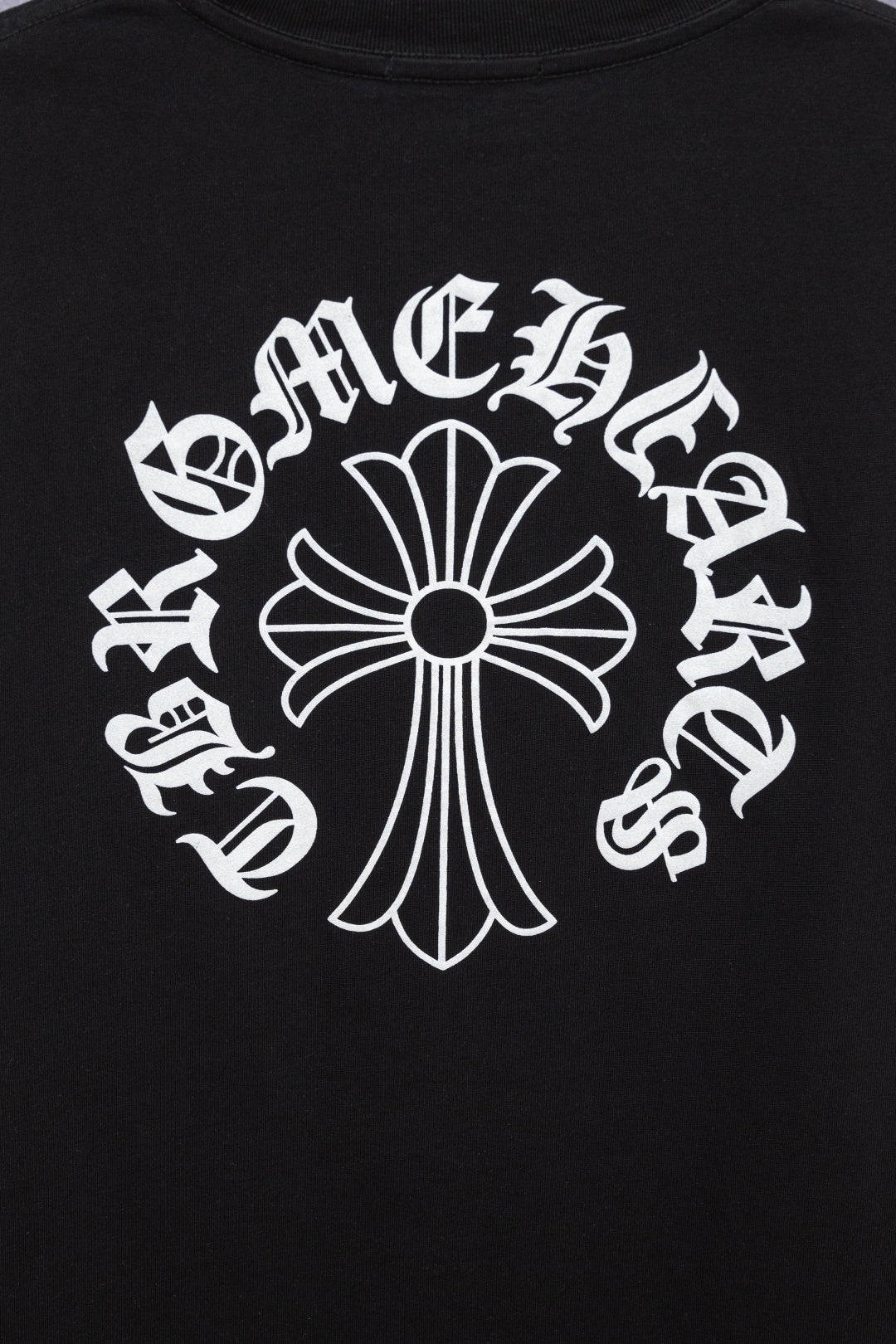Black T-shirt front with large white cross emblem and curved text graphic