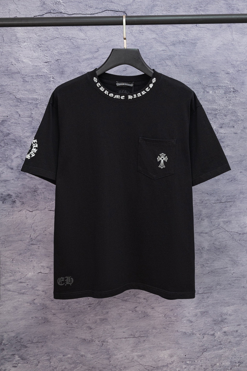 Black short-sleeve graphic T-shirt with small chest emblem on left side