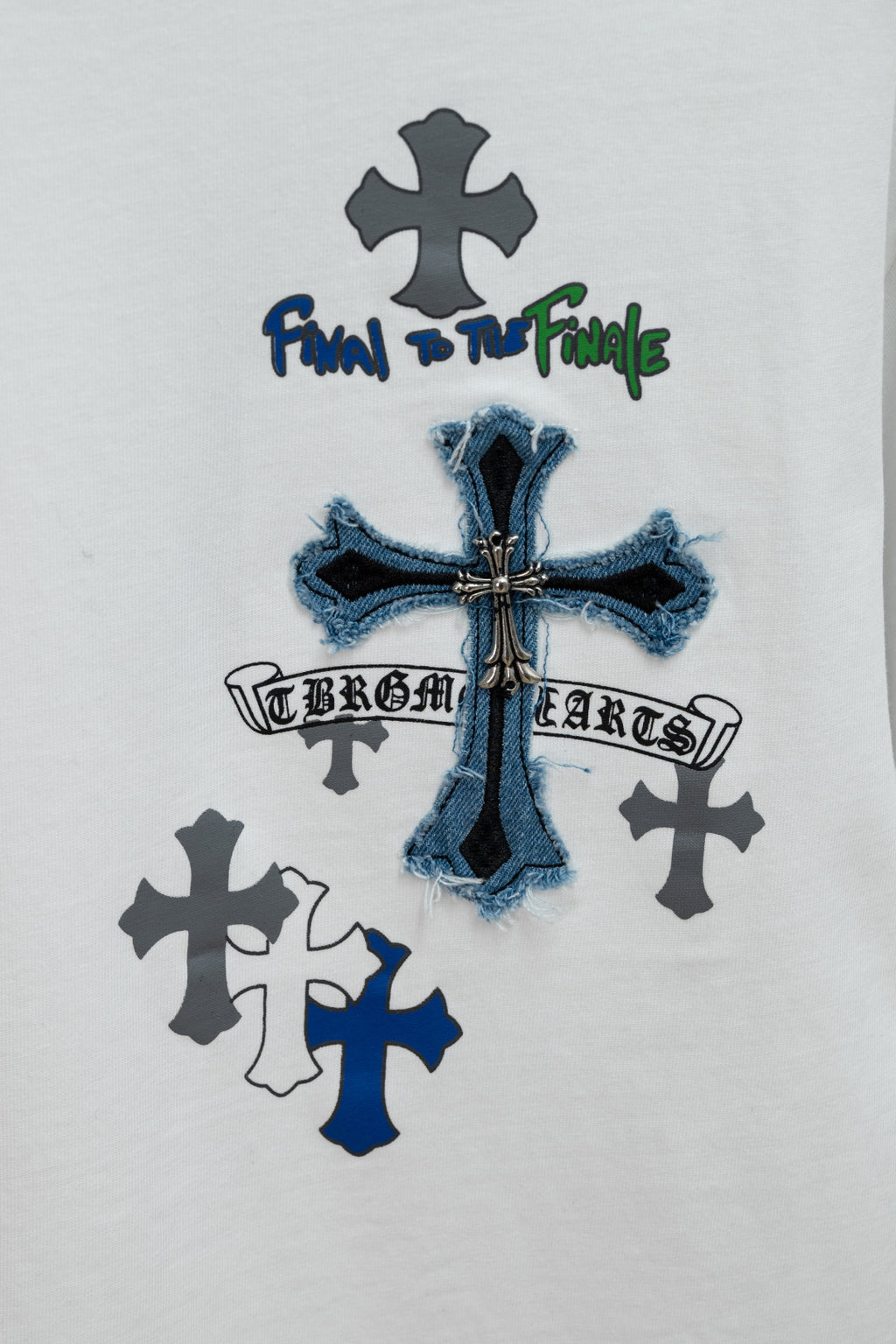 White short-sleeve T-shirt with blue denim-style cross and dark cross icons