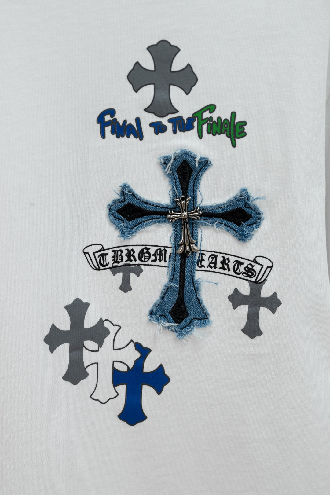 White short-sleeve T-shirt with blue denim-style cross and dark cross icons