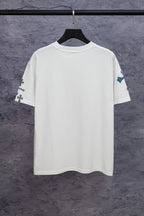 White short-sleeve T-shirt with blue cross print on left sleeve