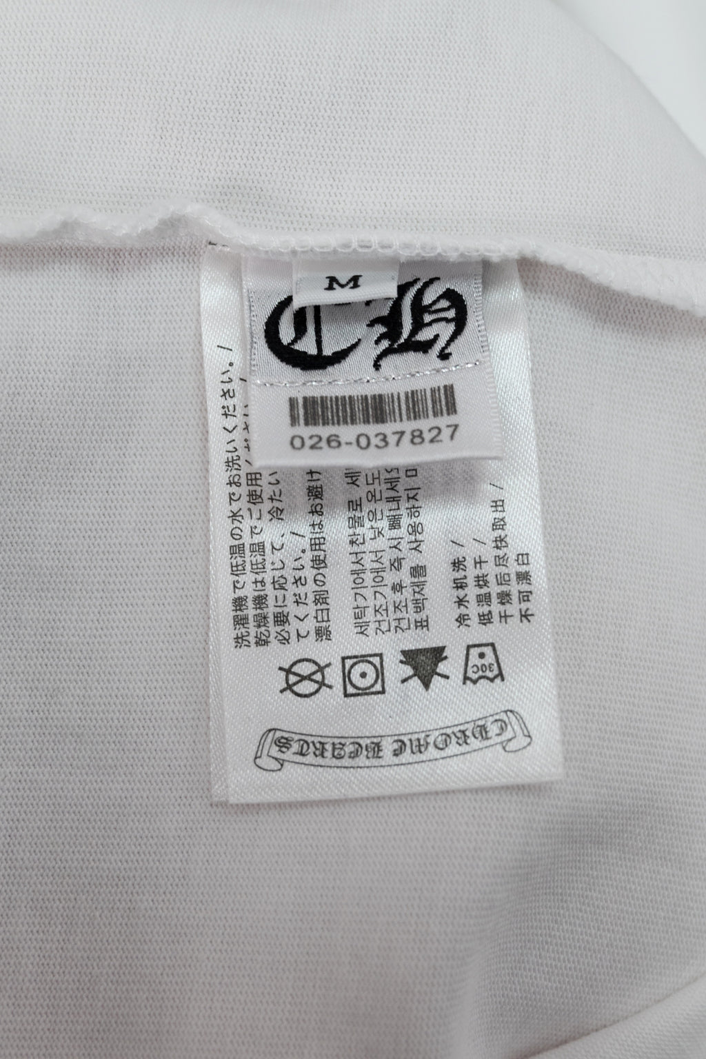 White T-shirt inner neck label with size and care information