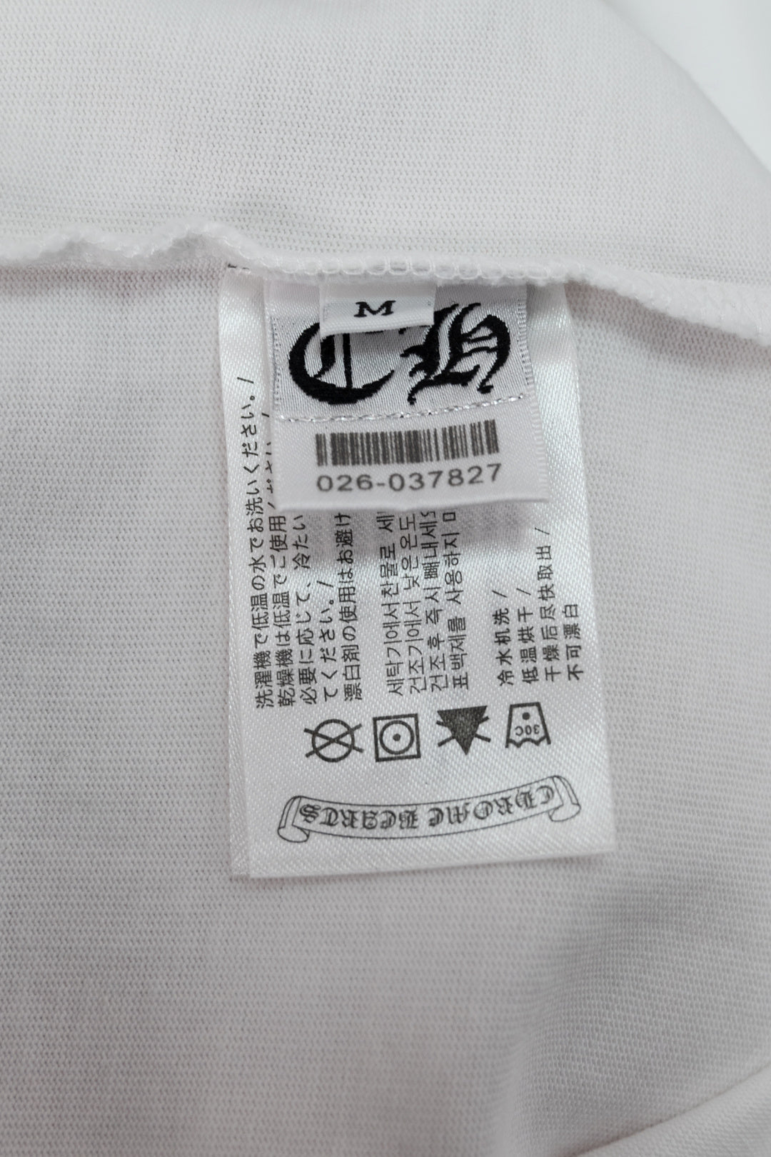 White T-shirt inner neck label with size and care information