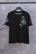 Black graphic T-shirt with blue cross artwork on chest, hanging on a black hanger