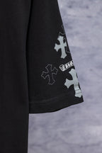 Black T-shirt sleeve with blue and white cross patch graphic