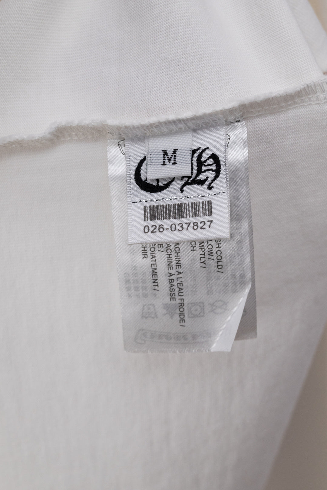 White T-shirt with clear size label and printed product details tag