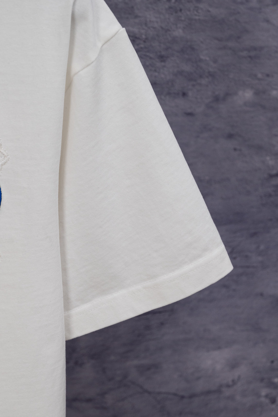 White short-sleeve T-shirt side view with crew neckline