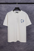 White short-sleeve T-shirt with blue chest graphic and small flower embroidery