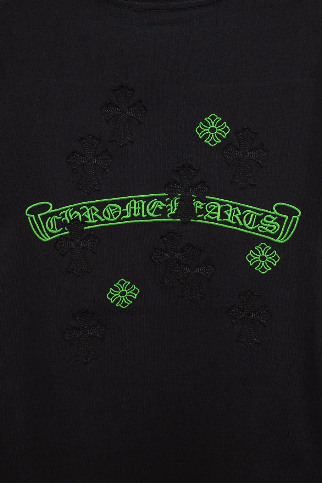 Black T-shirt back with neon-green logo text and small emblem icons