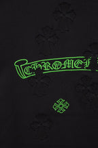Black T-shirt logo with neon-green outlined lettering and small icons