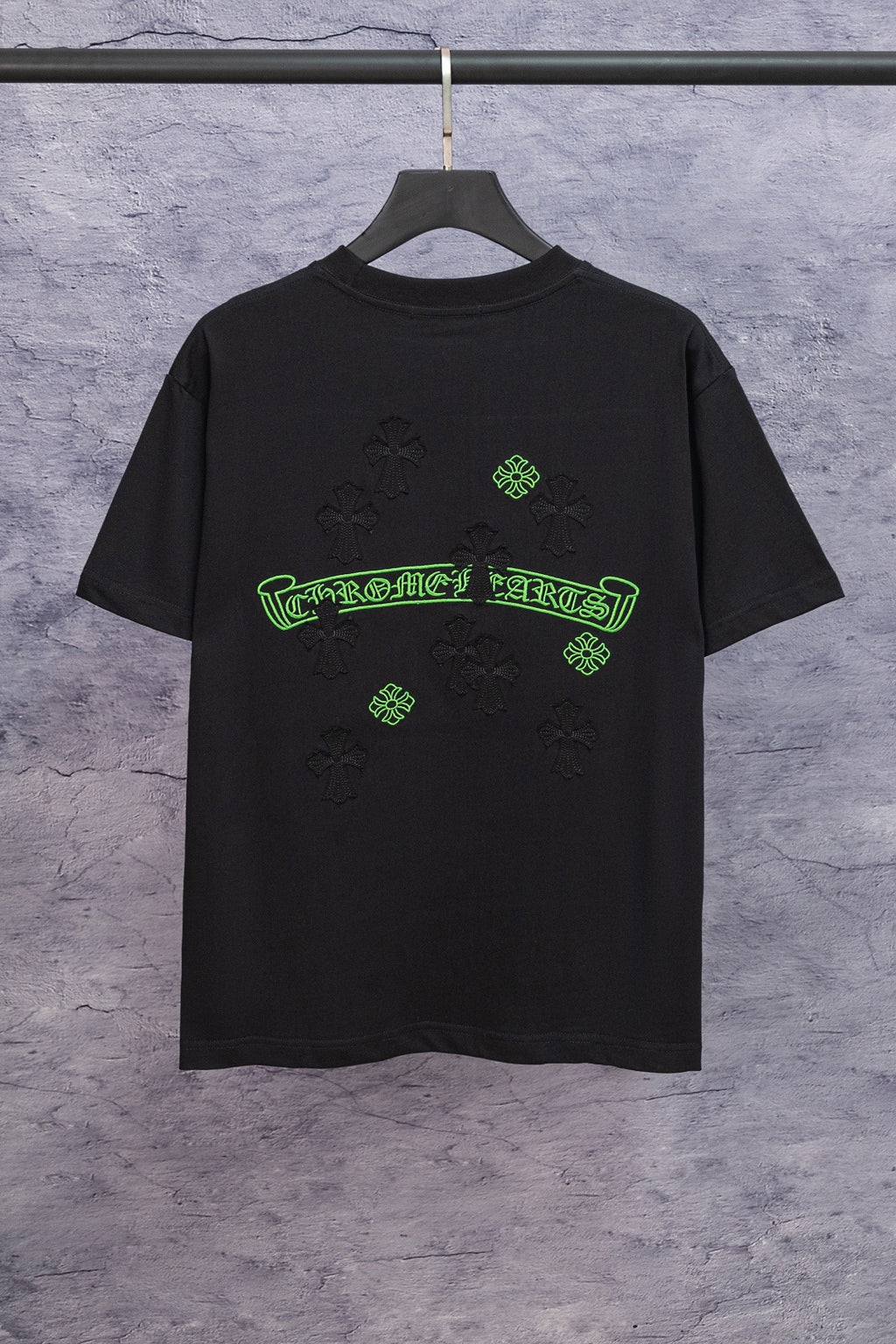 Black short-sleeve T-shirt with neon-green back graphic and cross symbols
