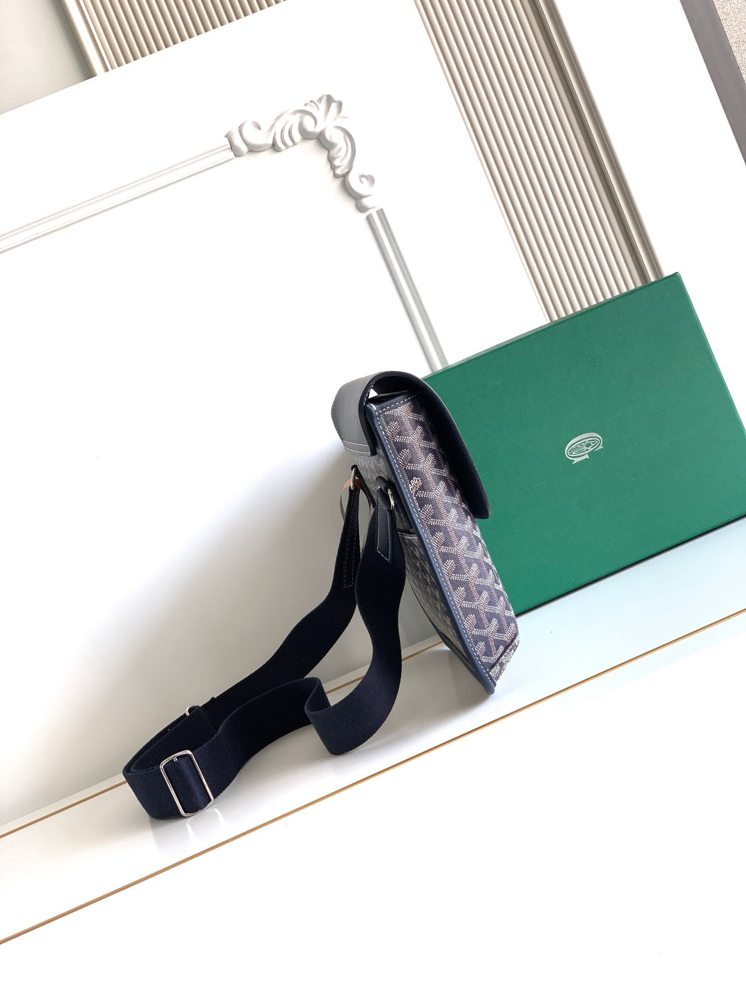 Navy monogram crossbody bag with adjustable strap and top flap opening