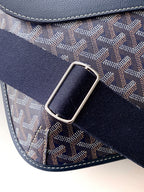 Navy strap with silver buckle on monogram shoulder bag with stitched edges