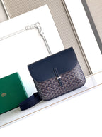 Navy monogram flap shoulder bag with blue crossbody strap and top zipper
