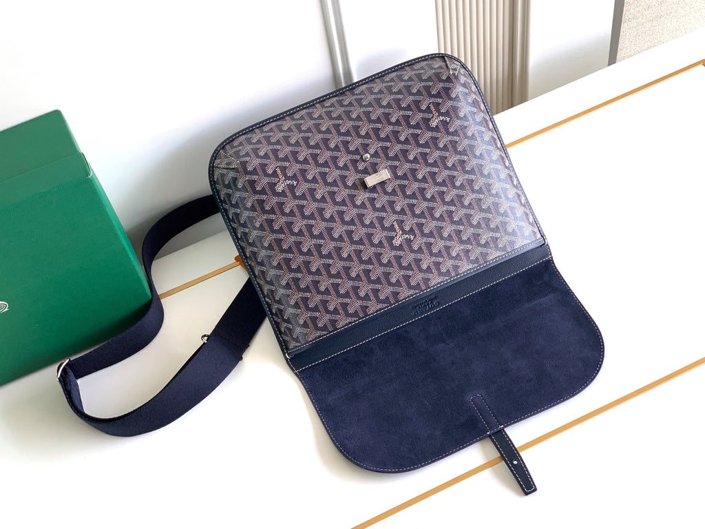 Navy monogram crossbody bag with front flap and matching navy leather pocket