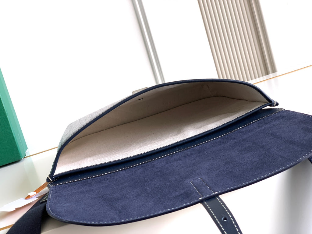 Navy flap crossbody bag showing beige interior lining under the top flap