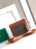 Goyard small crossbody bag with front flap and brown leather trim.